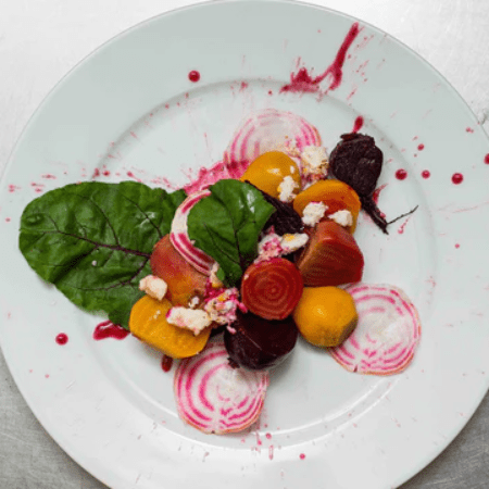 a plate with a beet salad